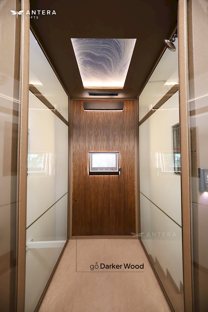 Thang máy cabin sử dụng gỗ Darker Wood tạo không gian hiện đại, ấm cúng.